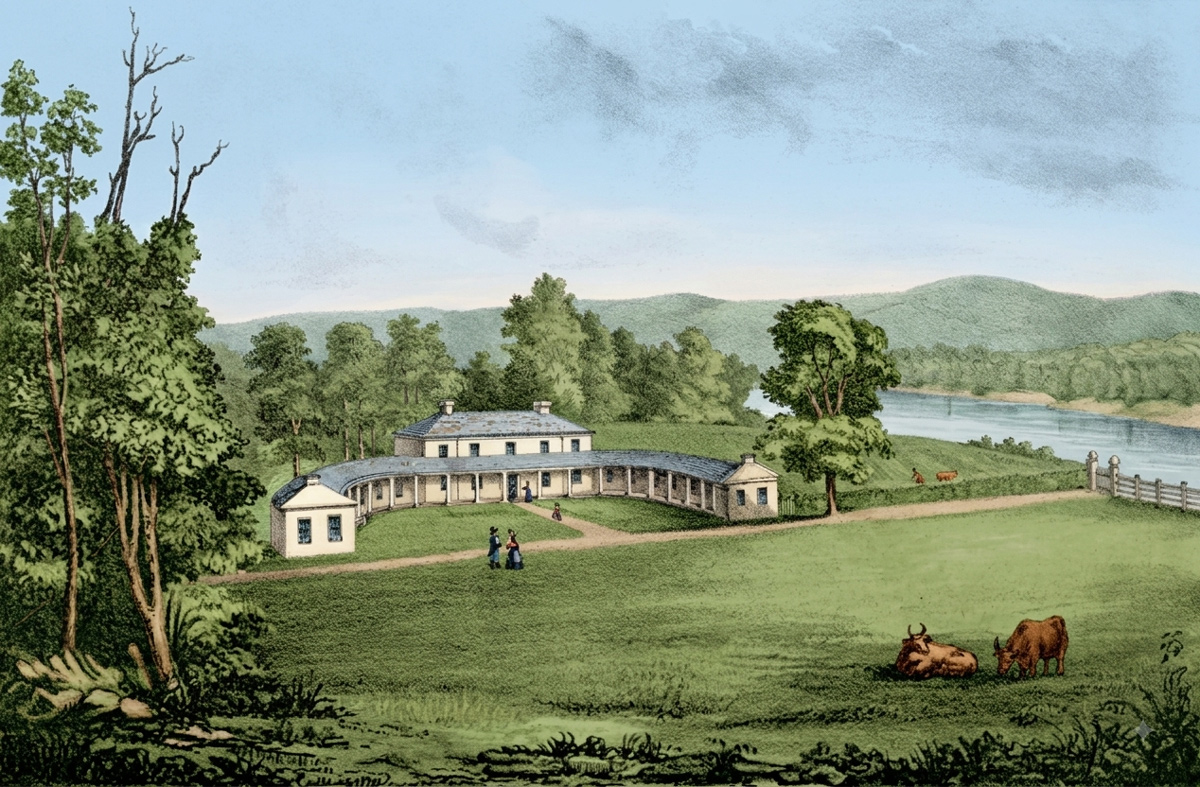 Large white house with two wings and a large lawn