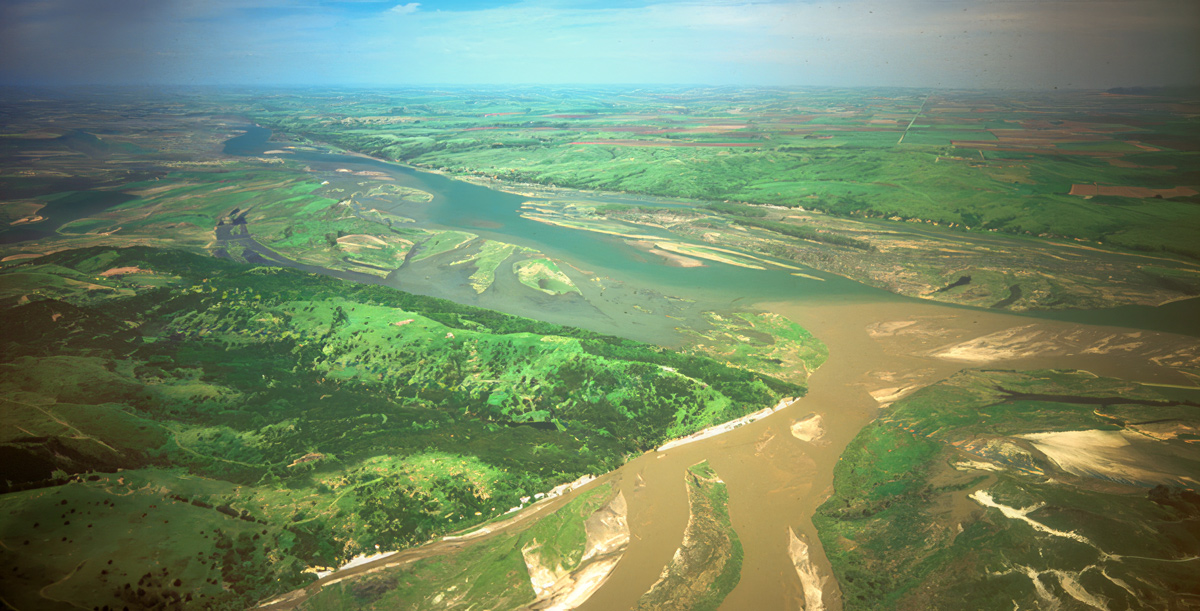 Aerial photo of a muddy river joining a clearer one