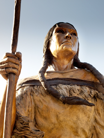 Sacagawea holding a tall walking stick